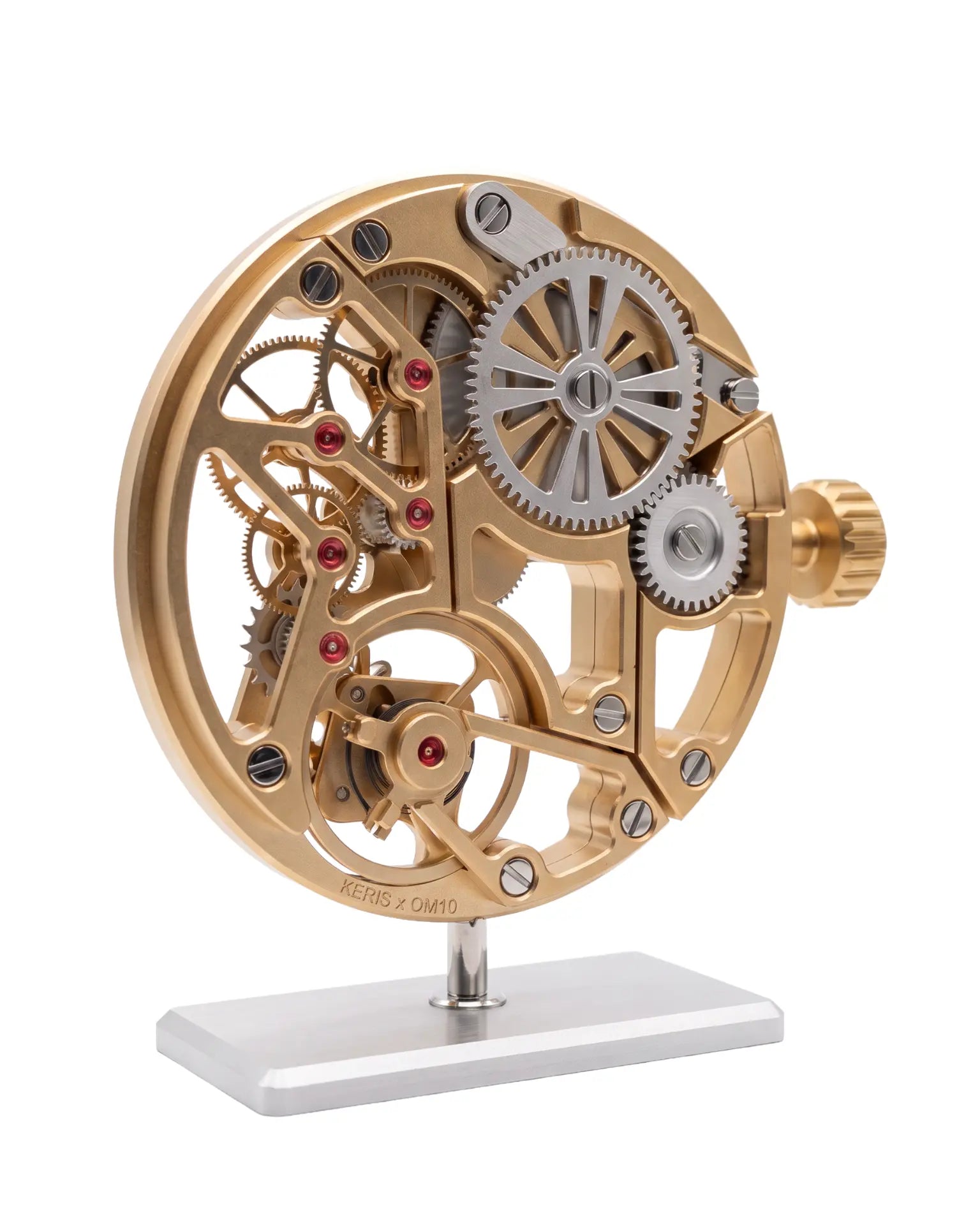 MECA TRADITION — Front view of the champagne-anodized skeletonized calibre